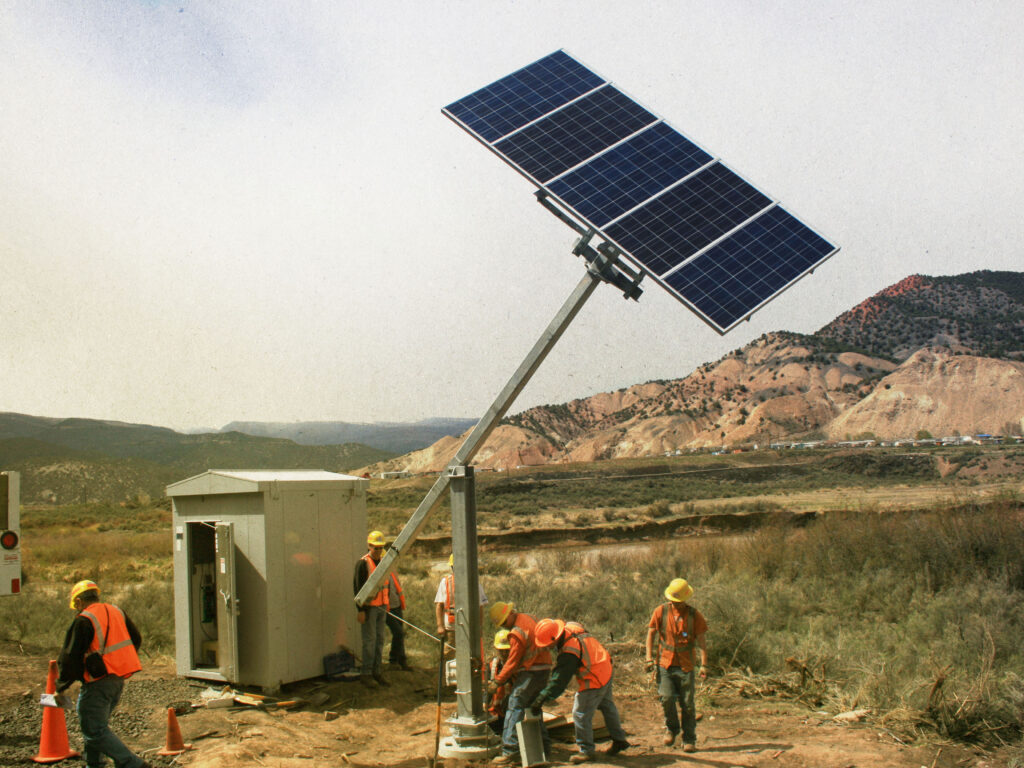 Solar tilt tower installation for railroad